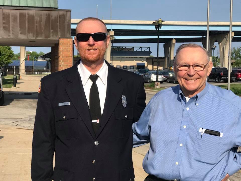 uniformed Jeff Erickson and dad Chuck